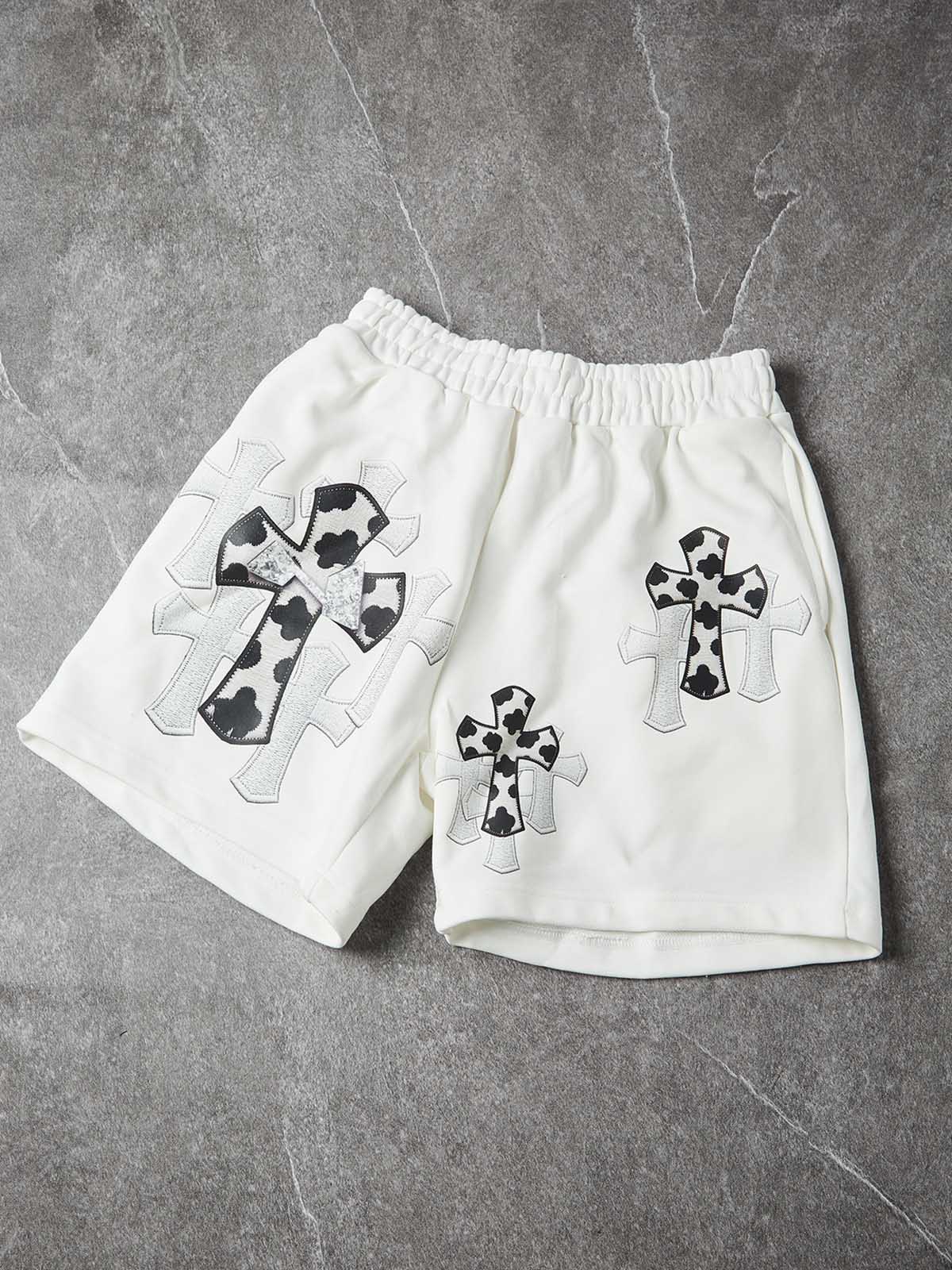 NOISSEY "COW CROSS" MONOCHROME APPLIQUÉ WIDE-LEG SHORTS